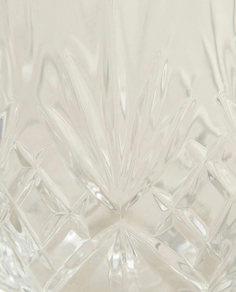 CRYSTALLINE TUMBLER WITH RAISED DESIGN
