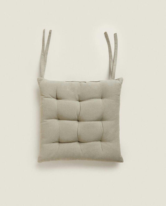QUILTED CHAIR CUSHION WITH TIES